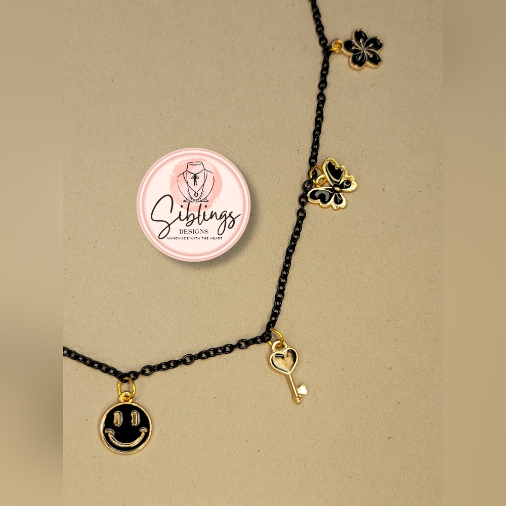 Necklace with black and golden charms - Picture 2 of 6